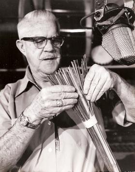 MacDonald using straws to make sound effects, circa 1950s.