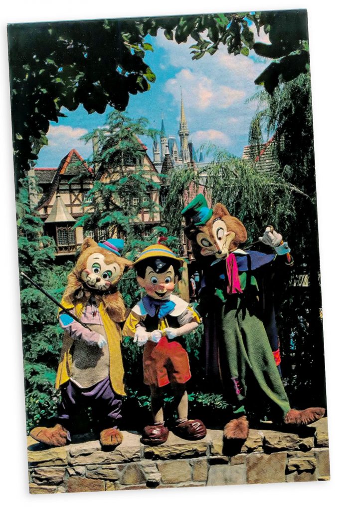 Watch out Pinocchio! (Postcard)

Pinocchio relaxes with his two "friends" Foulfellow and Gideon in Fantasyland. This is the happiest land of them all, where guests meet dozens of famous characters "come to life" from Disney animated film classics.