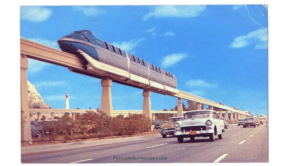America's first daily-operational monorail trains transport passengers over a concrete "highway in the sky" between Disneyland and the Disneyland Hotel on the Disneyland-Alweg monorail system. (Postcard)